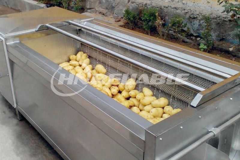 Potato cleaning and peeling machine